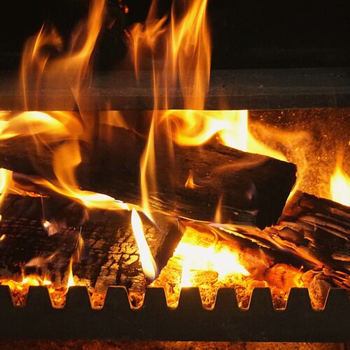 Classic fireplace decorated for the holidays.